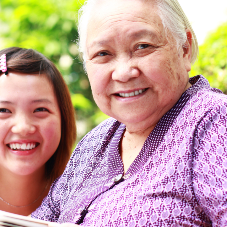 Senior smiling with grand daughter in park near Retirement Home in Richmond Hill